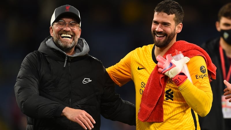 Jurgen Klopp (l) with Alisson Becker after Liverpool's win at Burnley