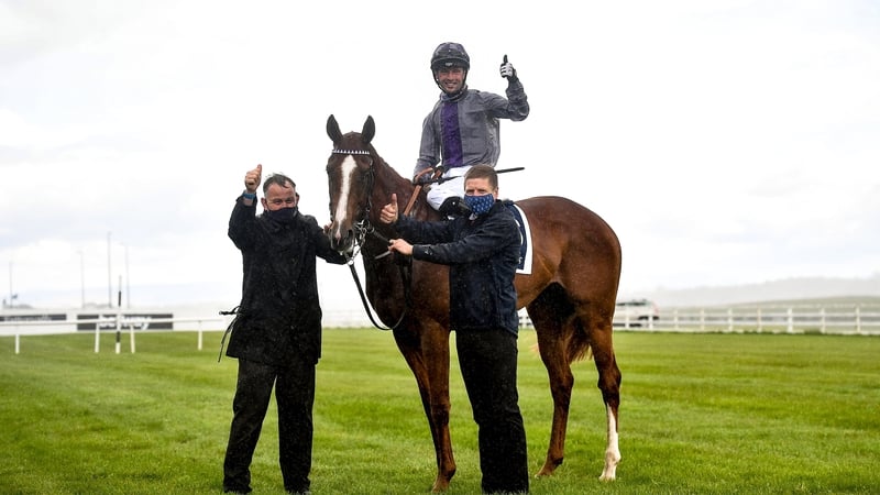 Jockey Rory Cleary celebrates on Mac Swiney after winning the Tattersalls Irish 2,000 Guineas