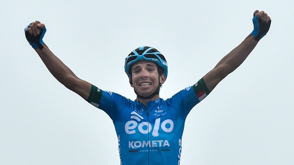 Lorenzo Fortunato celebrates as he crosses the finish line to win the 14th stage