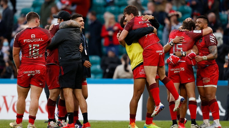 Toulouse players celebrate victory at the final whistle