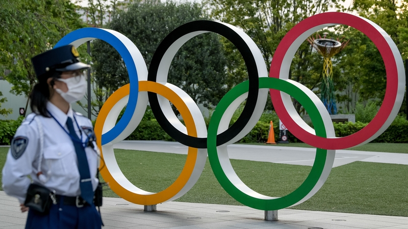 A policewoman pictured at the National Stadium in Japan where protests against the Olympics were staged earlier this month