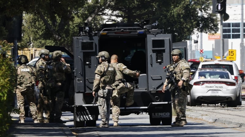 Armed police at the scene of the shooting at the San Jose Valley Transportation Authority light rail yard