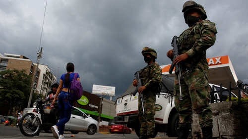 Soldiers guard the streets after the Colombian president ordered more military presence, one day after violent anti-government protests, in Cali