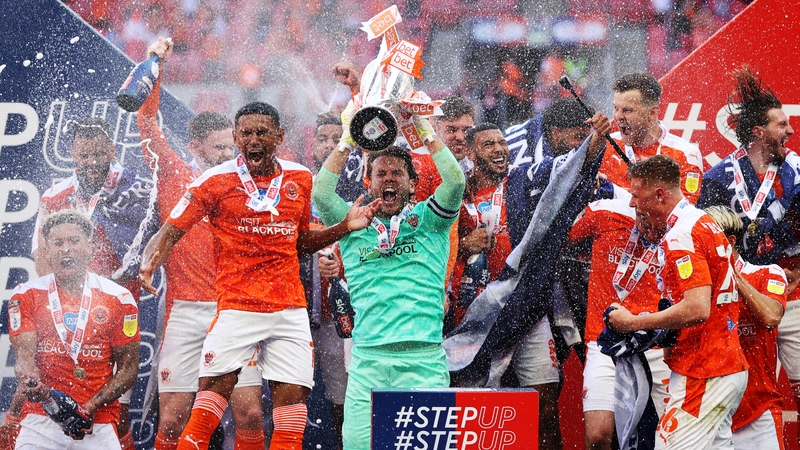 Chris Maxwell of Blackpool lifts the League One Play-off Trophy