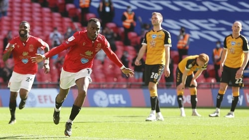 Carlos Mendes Gomes wheels away in celebration after scoring from the spot