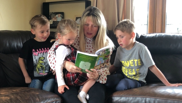 Eleanor Merriman reads her first book to three of her five children