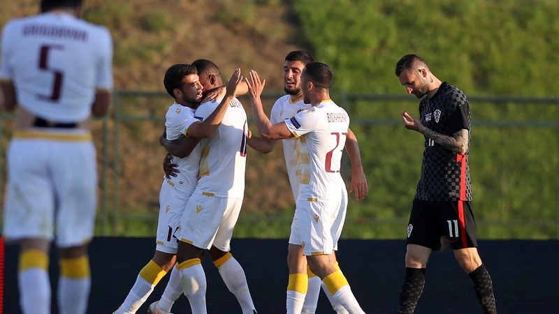 Armenian players celebrate after scoring the equaliser