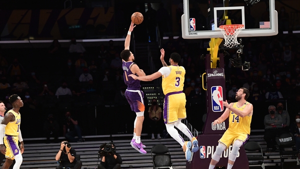 Devin Booker drives to the basket at Staples Center