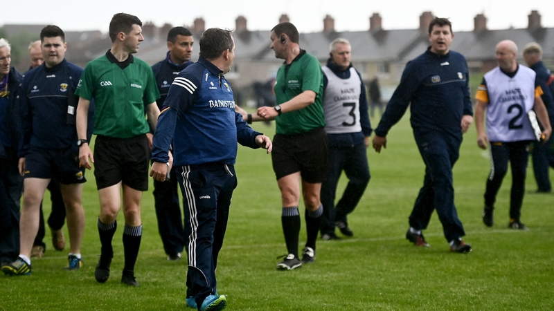 Wexford manager Davy Fitzgerald and Antrim manager Darren Gleeson exchange words at half time