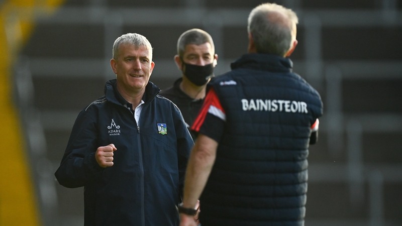 Limerick boss John Kiely (L) greets Cork manager Kieran Kingston after the game