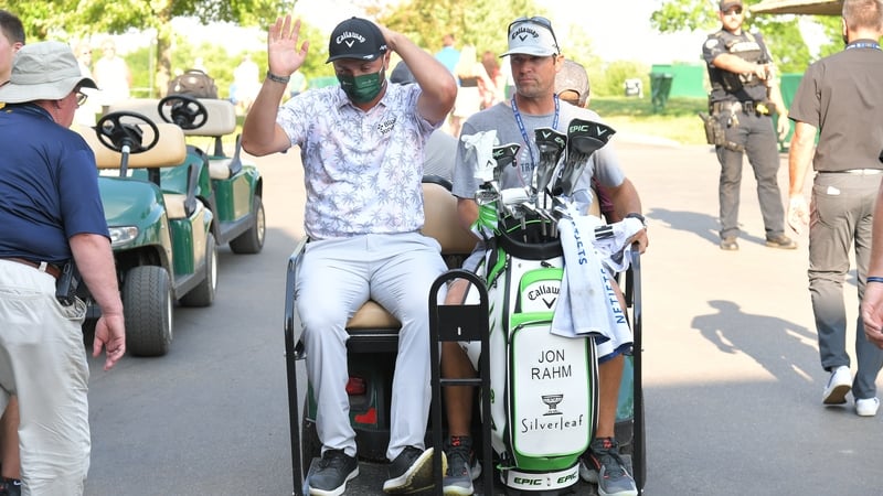 Jon Rahm is driven off the course after learning he was positive for Covid-19