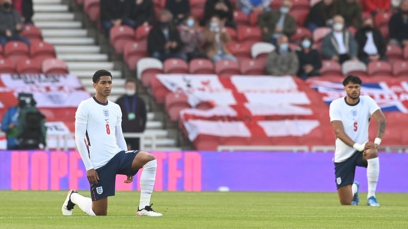 Jude Bellingham and Tyrone Mings take the knee ahead of the Austria game mid week