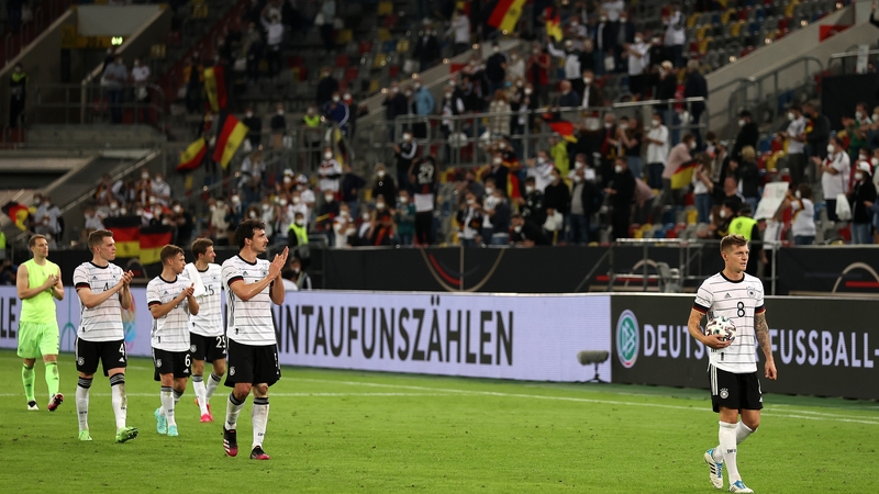 Toni Kroos leads the German players on a farewell lap of honour at Merkur Spiel-Arena in Duesseldorf