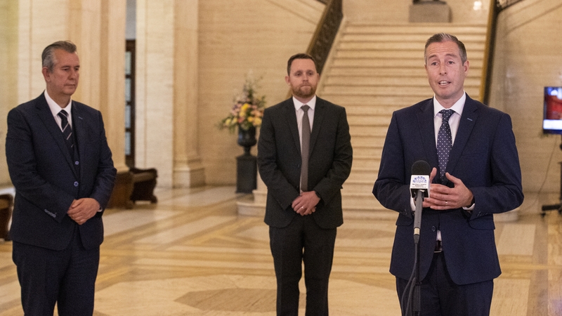 Paul Givan (R) entered politics as a researcher for Edwin Poots (L) as a 17-year-old