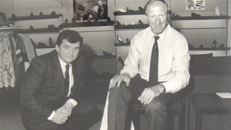 Founder Nevil O'Sullivan serves one of the shops most famous customers at Nevil's Shoes in Limerick