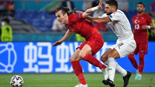 Domenico Berardi of Italy is held back by Caglar Soyuncu of Turkey