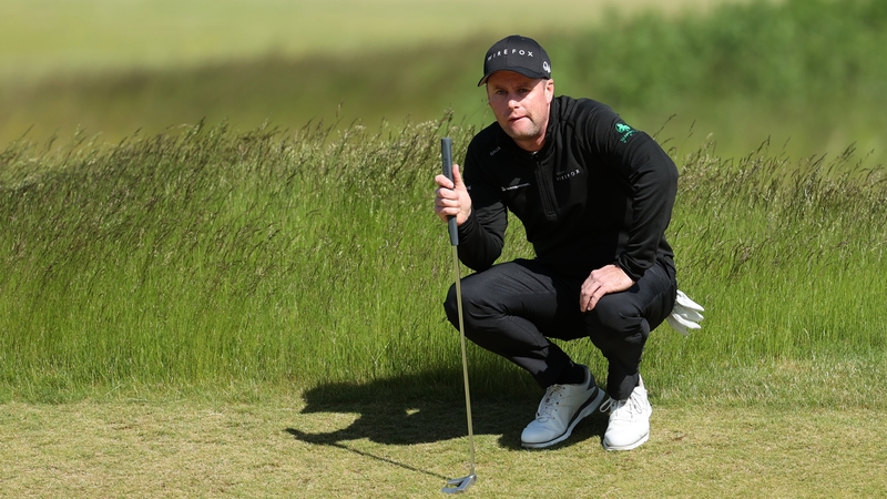 Caldwell lines up a putt on the 13th hole