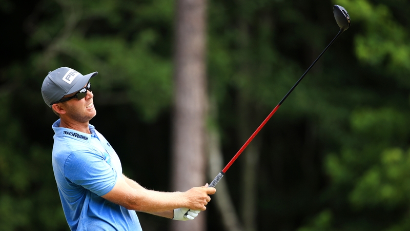 Power plays his shot from the 12th tee