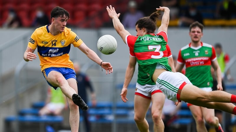 Oisín Mullin blocks a shot from Joe McGann