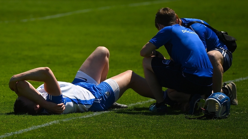 Austin Gleeson receives treatment on an ankle injury