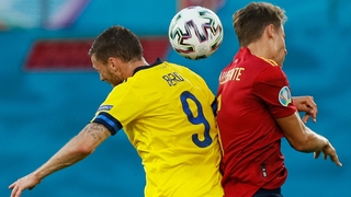 Sweden's Marcus Berg heads the ball with Spanish defender Diego Llorente