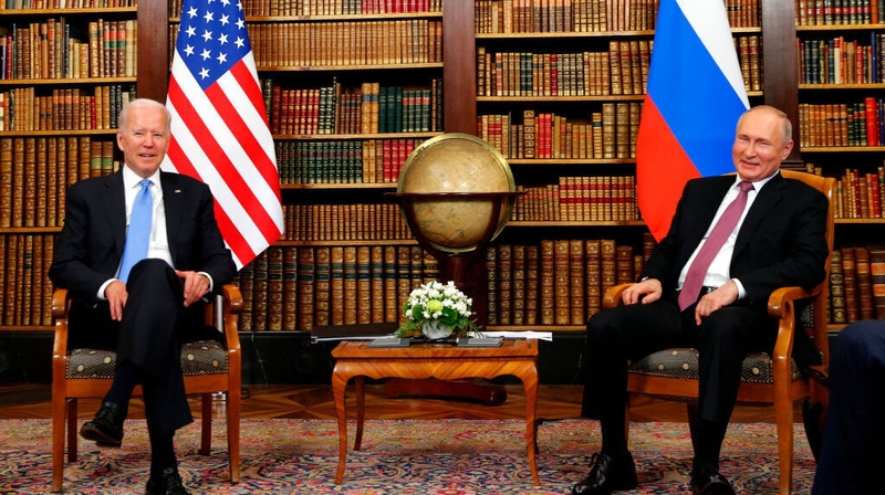 Joe Biden (L) and Vladimir Putin meet at the start of the US-Russia summit at Villa La Grange in Geneva