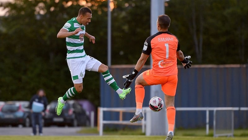 Burke scores the Hoops' third goal past Waterford goalkeeper Brian Murphy