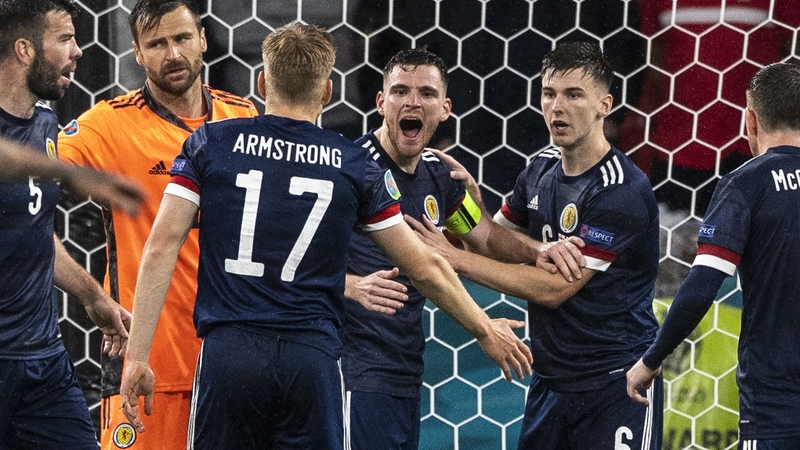 Andrew Robertson (centre) celebrates a late clearance as Scotland claimed a deserved draw at Wembley