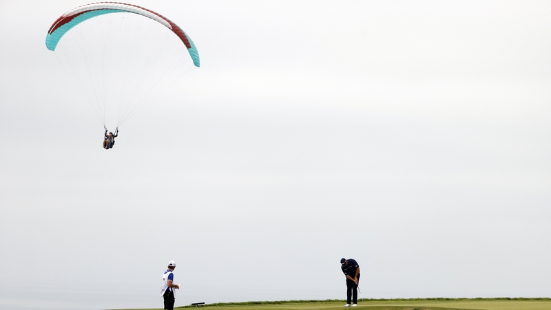 Lowry putts on the fourth green