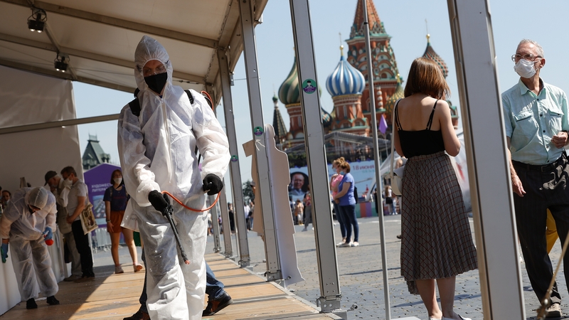 Workers disinfect a book fair in Moscow