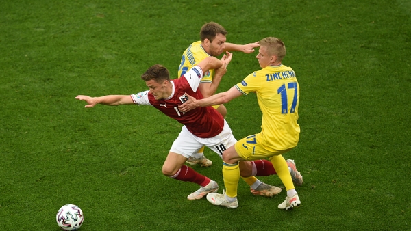 Christoph Baumgartner of Austria battles for possession with Oleksandr Zinchenko of Ukraine