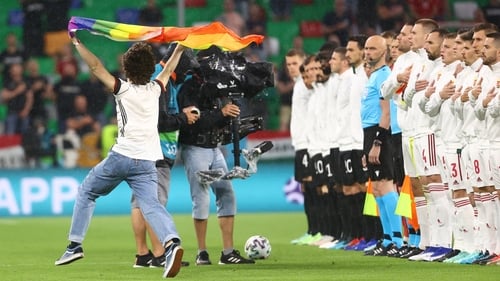 A pitch invader waved a rainbow flag as Hungary and Germany lined out on Wednesday