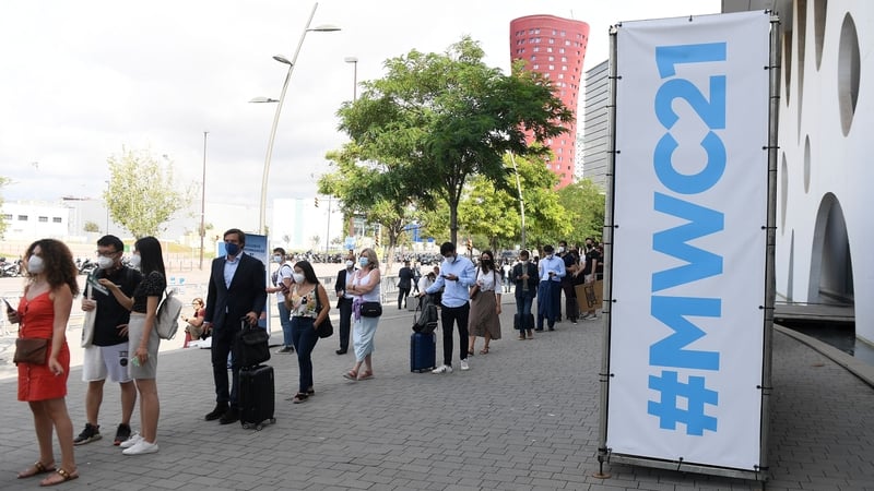 Visitors queue to take a Covid-19 test before entering the Mobile World Congress (MWC) fair in Barcelona today