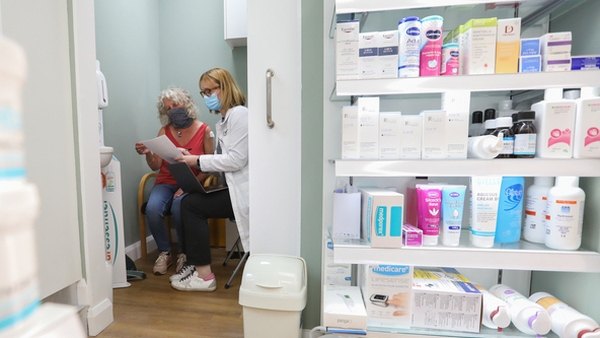 People are usually asked to wait for 15 minutes to ensure they do not experience an immediate reaction to a vaccine dose