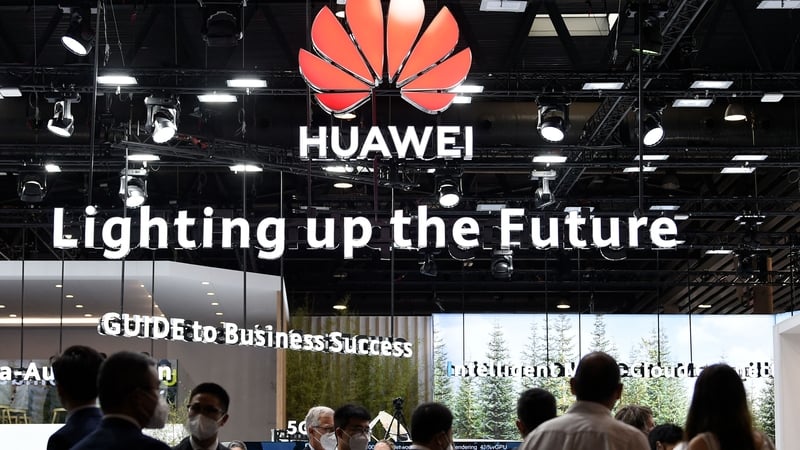 People visit the Huawei stand at the Mobile World Congress fair in Barcelona today