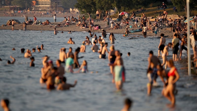 Beachgoers on Kitsilano Beach in Vancouver, British Columbia, Canada