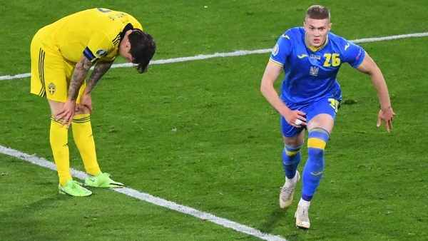 Artem Dovbyk (R) celebrates after scoring Ukraine's extra time winner