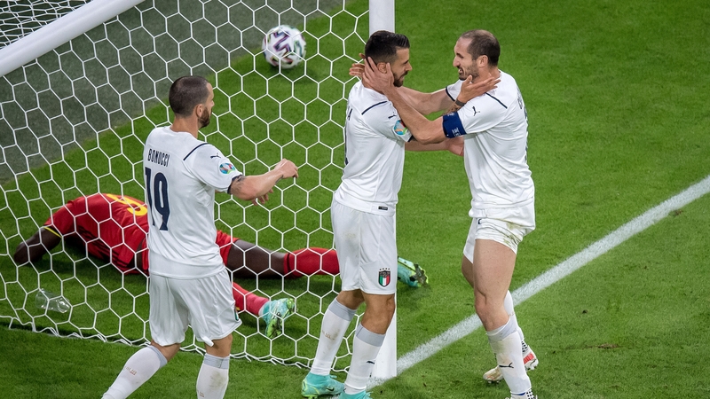 Italian defenders celebrate after preventing a Romelu Lukaku chance