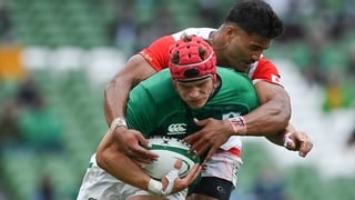 Siosaia Fifita attempts to tackle the outstanding Josh van der Flier