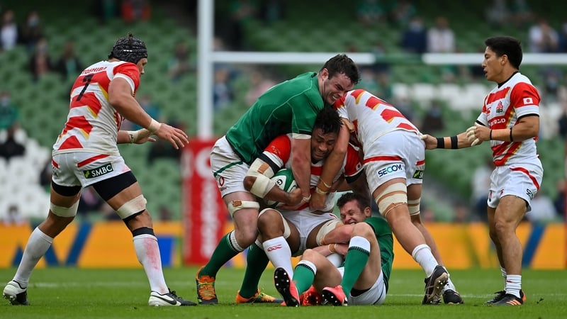 Amanaki Mafi of Japan is tackled by James Ryan and Billy Burns