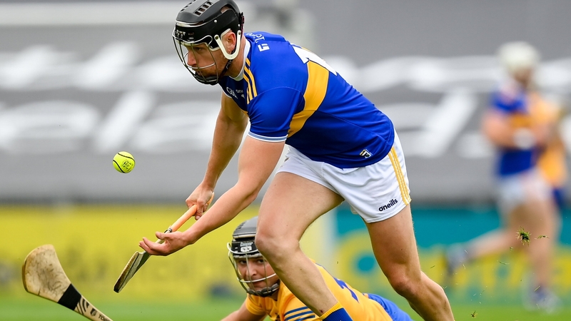 Tipperary forward Dan McCormack beats Cathal Malone to possession