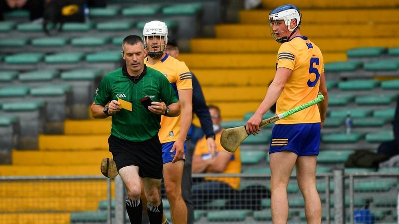 Diarmuid Ryan appeals to James Owens after he had issued a yellow card to his team mate Aidan McCarthy