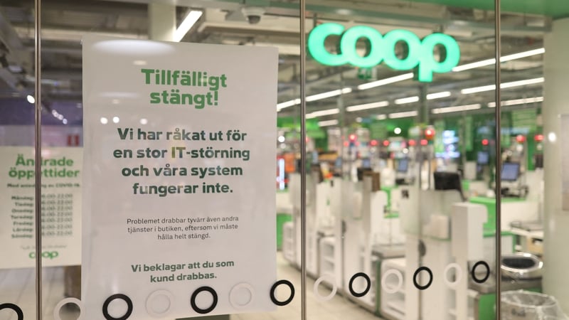 A sign reading 'Temporarliy closed - We have an IT-disturbance and our systems are not functioning' is posted in the window of a closed Coop supermarket in Stockholm