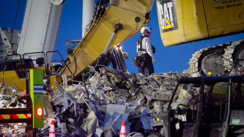 Search and rescue teams at work last night at Surfside, Florida
