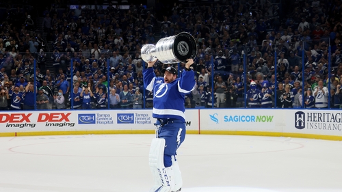 Curtis McElhinney of the Tampa Bay Lightning hoists the Stanley Cup