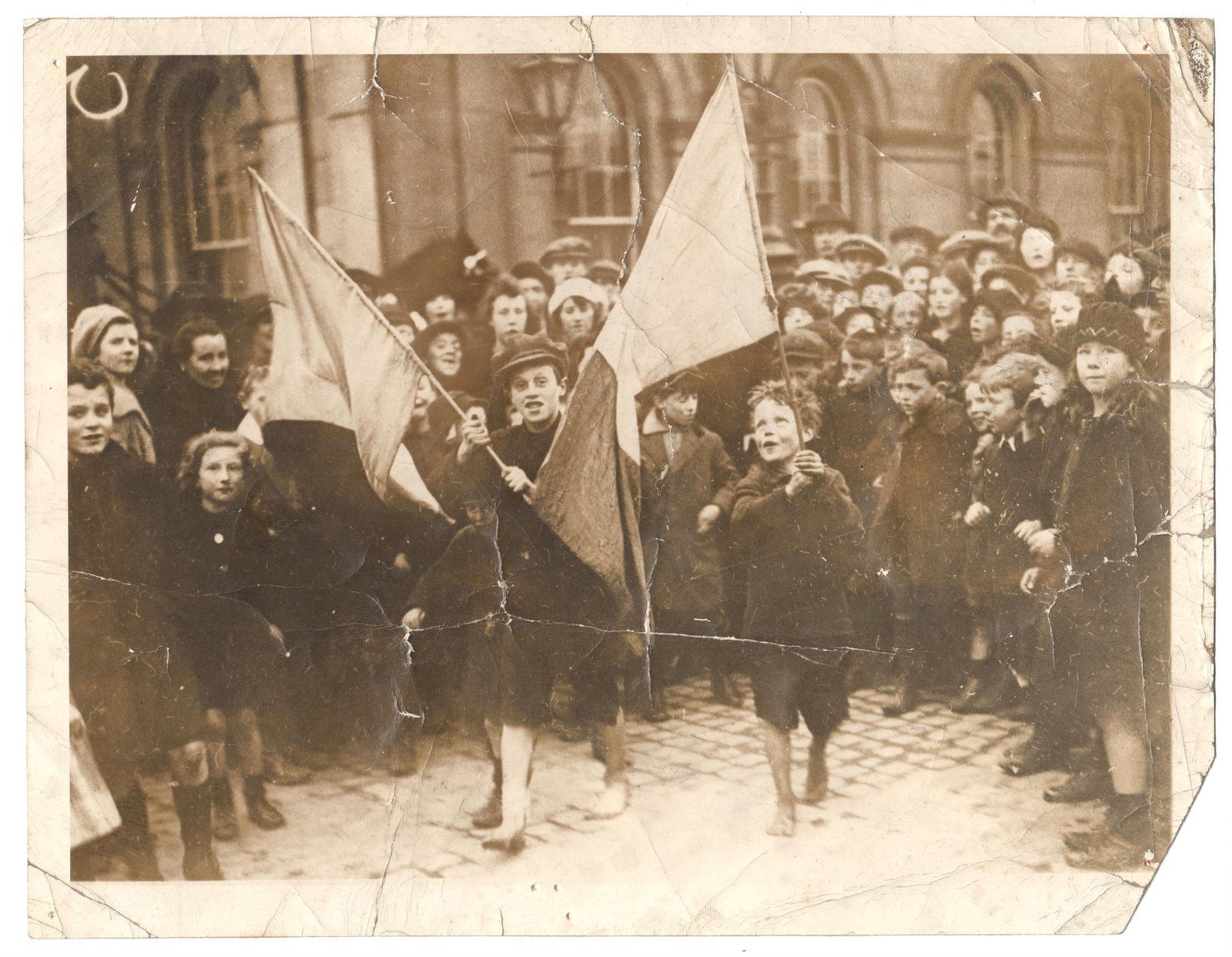 Joy on the streets of Dublin after the Truce was declared: children wave Tricolours. (Credit: Courtesy of Kilmainham Gaol Museum.19PO-1A33-24)