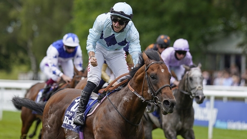 Tom Marquand and Starman cross the line ahead of the rest in the July Cup at Newmarket .