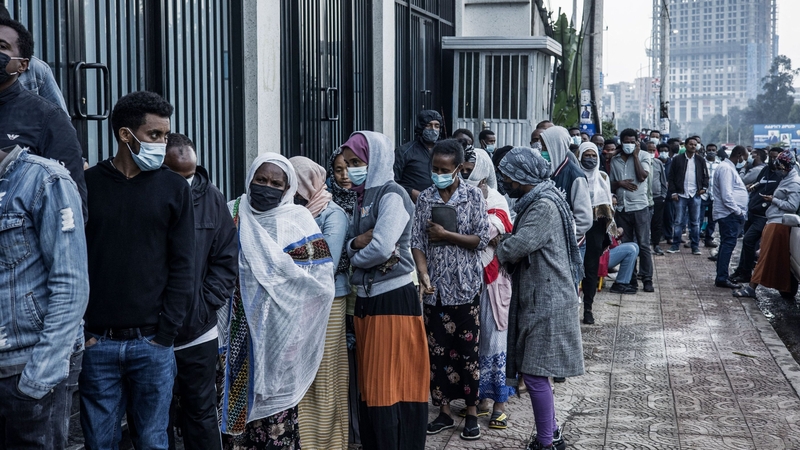 A long queue of voters wait outside a polling station in Addis Ababa, Ethiopia