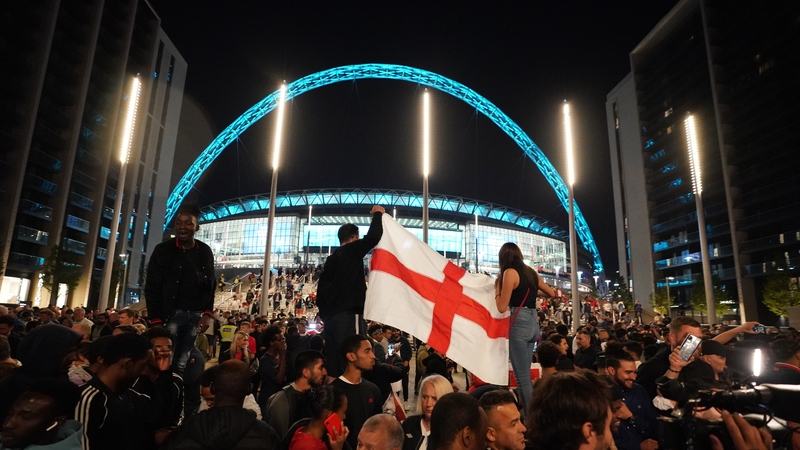 England fans celebrate outside Wembley Stadium after England qualified for the Euro 2020 final