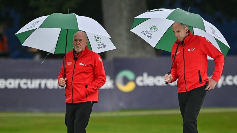 Umpires Alan Neill, left, and Roland Black